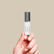 A clear bottle of fragrance oil with a silver screw on lid and black text that reads, 'Lake & Skye 11 11 Fragrance'.