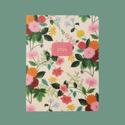 A floral notebook with text in the center that reads, 'Rifle Paper Co 2026 Monthly Planner'.