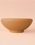 A ginger orange brown ceramic bowl planter.