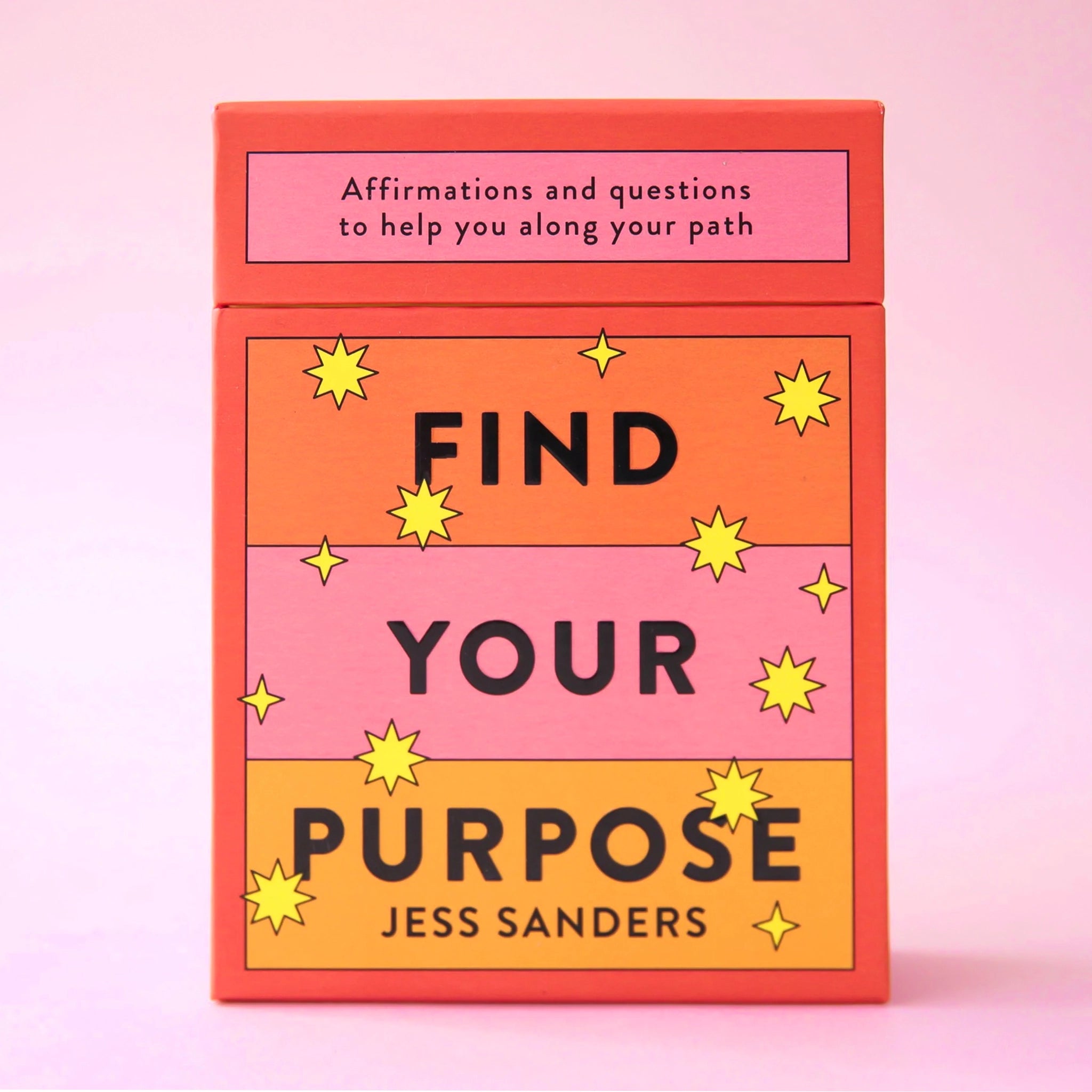 An orange, yellow and pink deck of cards with the words, &quot;Find Your Purpose&quot; on the front as well as &quot;Affirmations and questions to help you along your path&quot; in black writing.