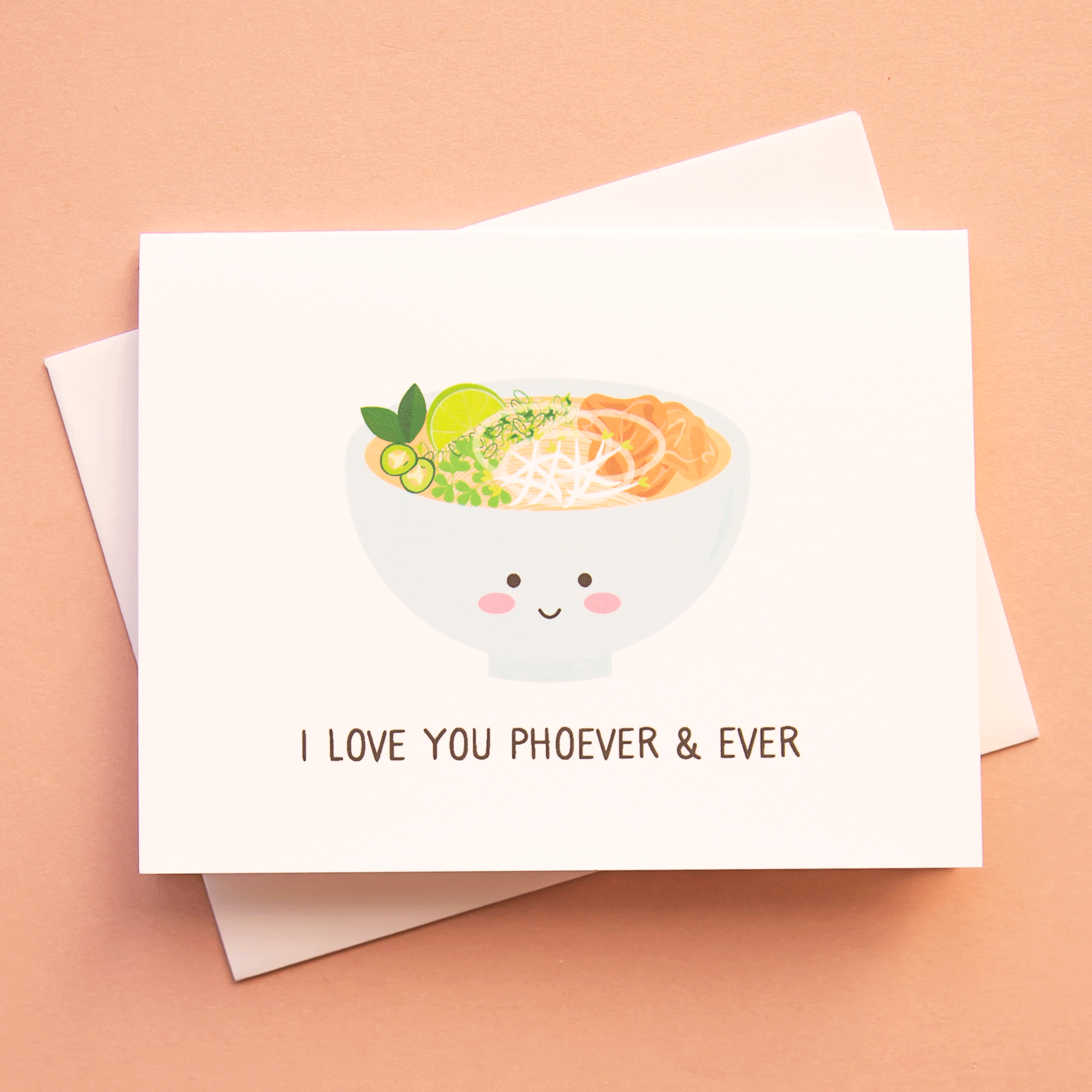 A white card with a colorful bowl of pho in a light blue bowl that has a smiling face and text underneath that reads, "I Love You Phoever & Ever" in black letters.