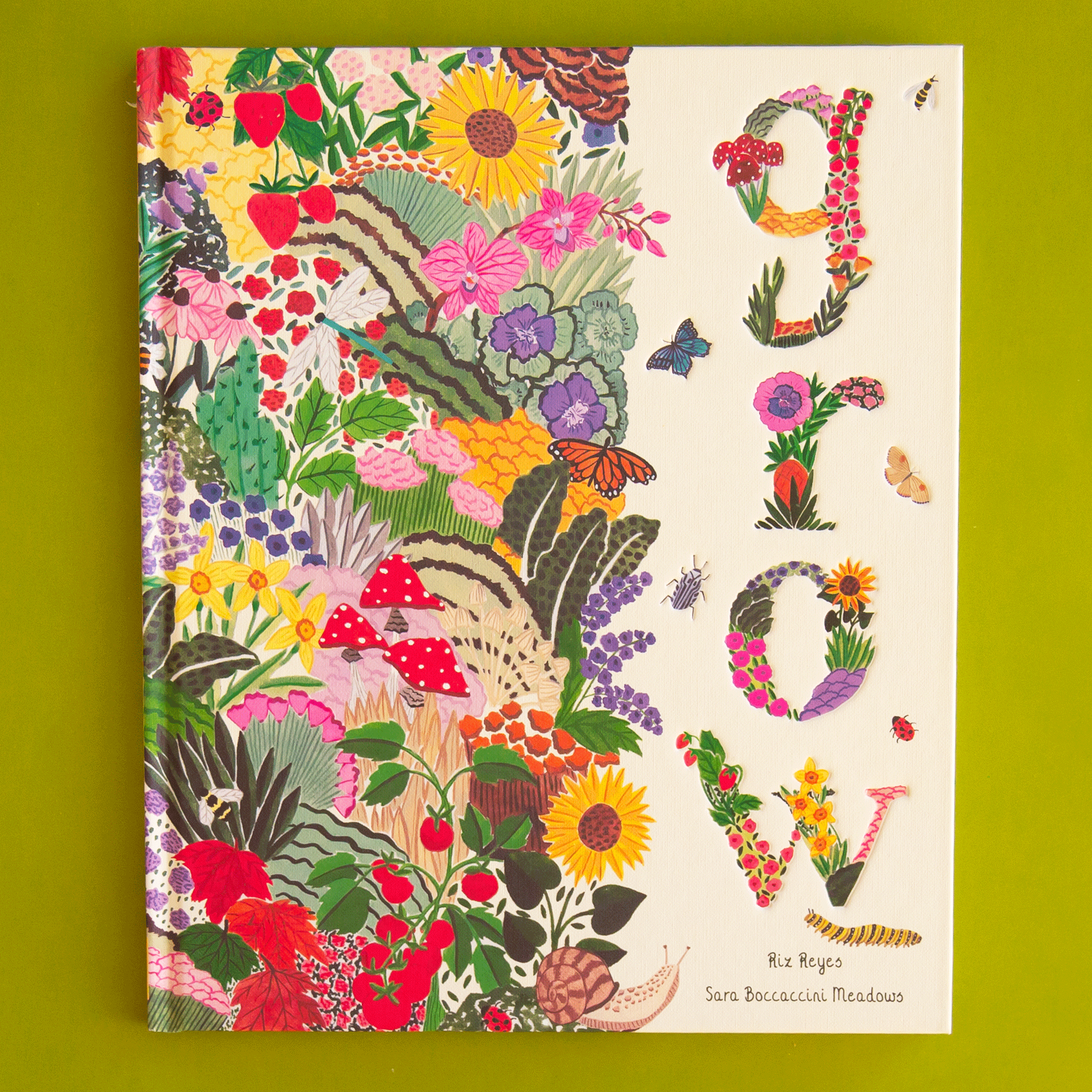 On a green background is a multi-colored book cover with flowers, fruits and greenery with a title that reads, &quot;grow&quot;. 