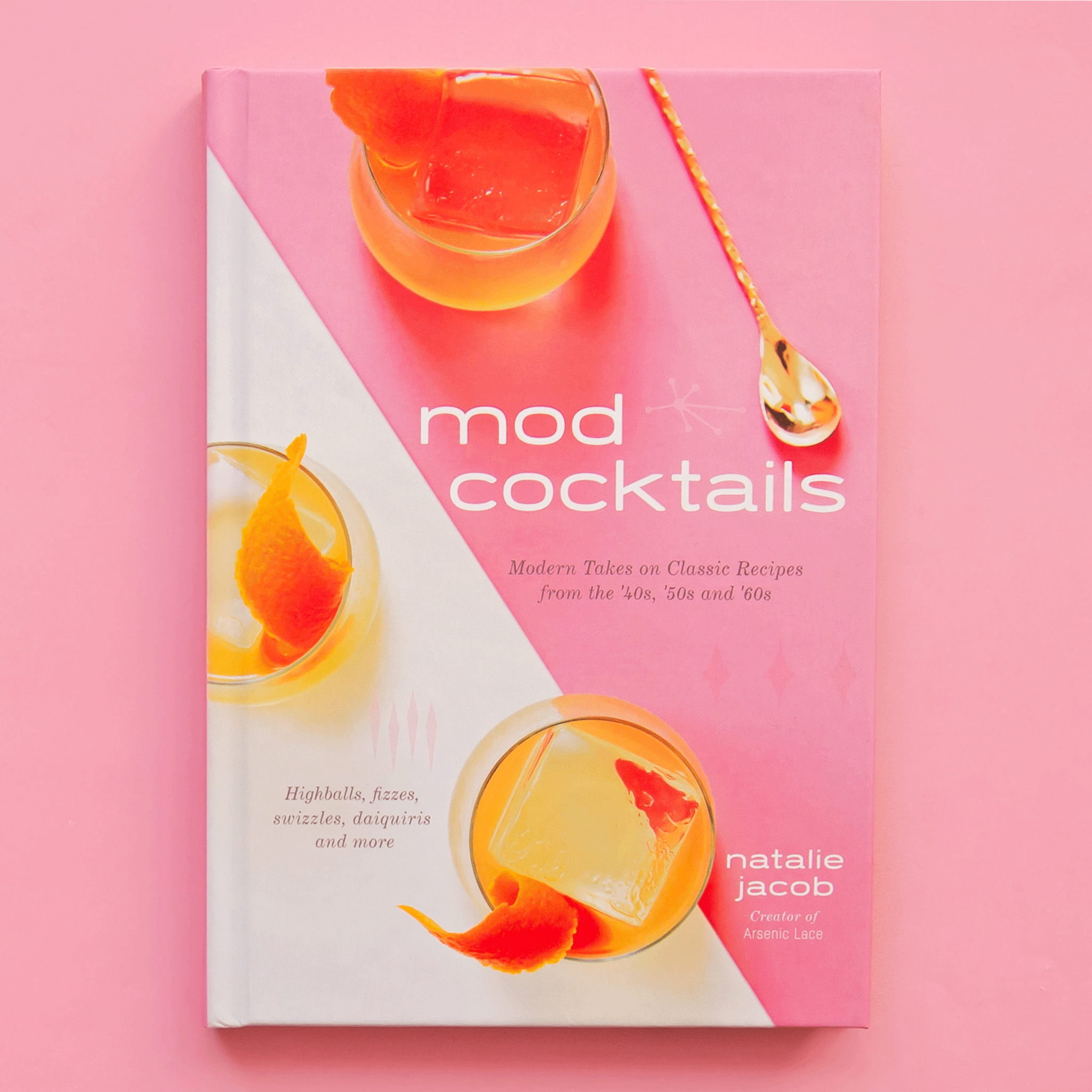 On a pink background is a pink bar book with cocktail glasses on the front cover and a title that reads, &quot;mod cocktails Modern Takes on Classic Recipes from the &#39;40s, &#39;50s and &#39;60s&quot;.
