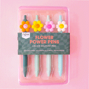On a pink background is a set of four ballpoint pens with a 3D smiley face daisy on each one in a different color. The pens themselves range between shades of light blue and teal.