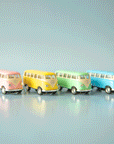 On a blue background is four VW bus shaped keychains in pink, yellow, green and blue. Each color sold separately.