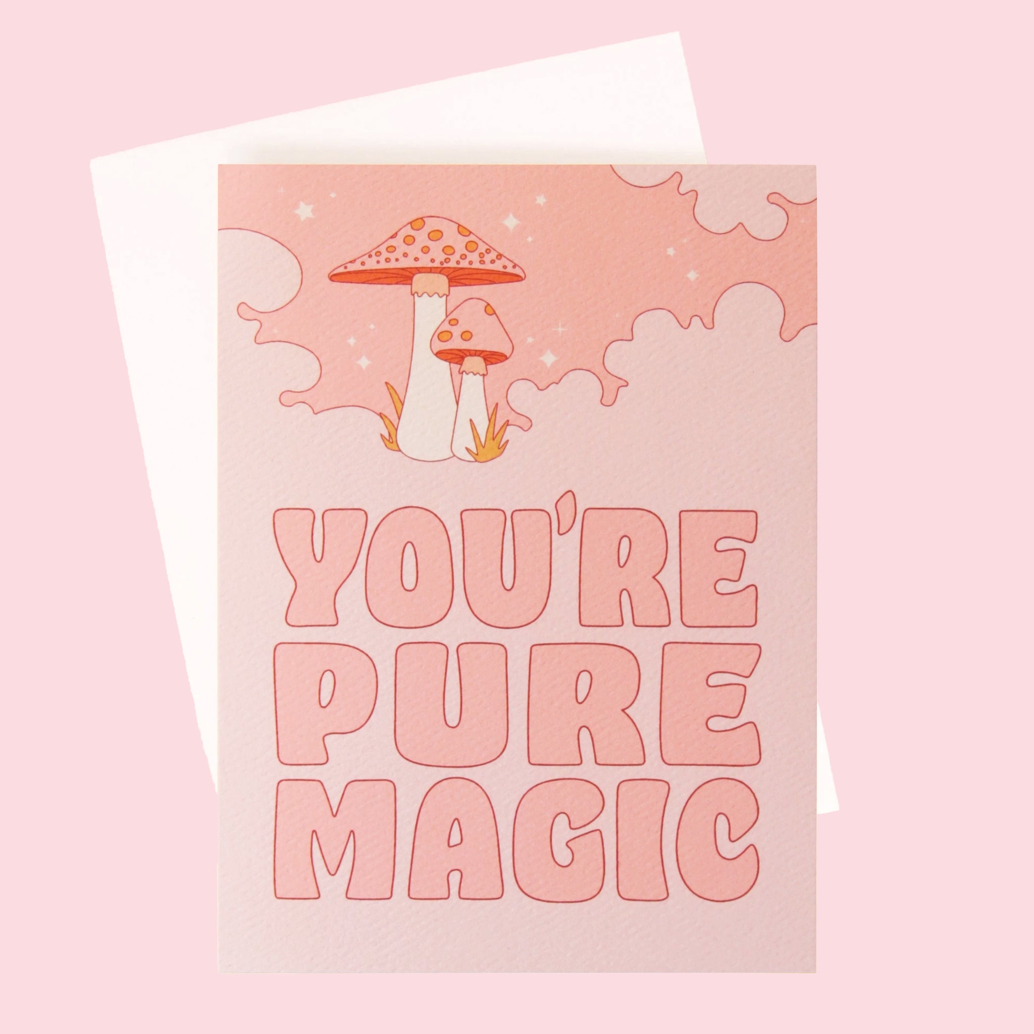  On a pink background is a pink greeting card with a cloud and mushroom design and pink text that reads, "You're Pure Magic".