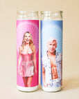 On a tan background is a blue prayer candle with a photo of Ken played by the actor Ryan Gosling and sitting next to another prayer candle available on our site featuring Barbie.
