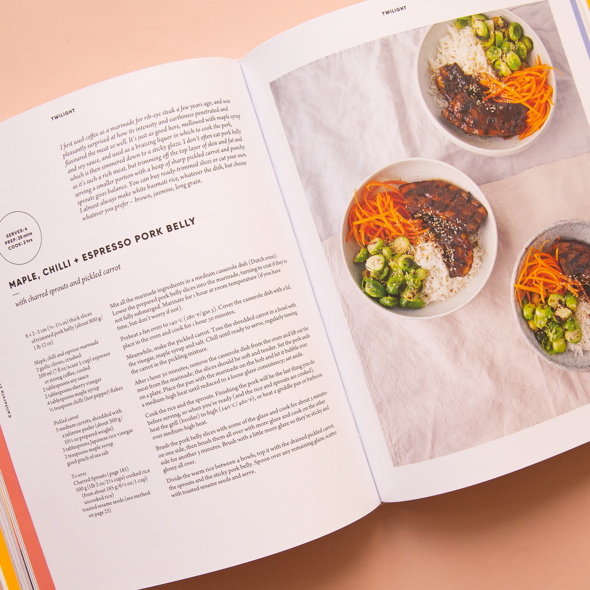The book open to a page with a recipe on the left side and a photo of food on the right. 