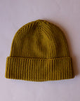 An olive green knit beanie.