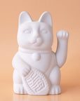 A ceramic lucky cat vase in white with its paw up in the waving position.