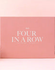 A pink box filled with a four in a row board game and white text that reads, "No 8 Four In A Row".