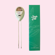 A light green moisture meter with a green box.