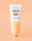 A white and light tannish orange tube of hand cream that reads, "Dew Me Intensely Moisturizing Hand Cream".