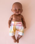 A pair of pastel checkered shorts on a Minikane doll that is sold separately.