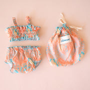 A coral and blue two piece swim suit for Minikane dolls. Dolls sold separately.