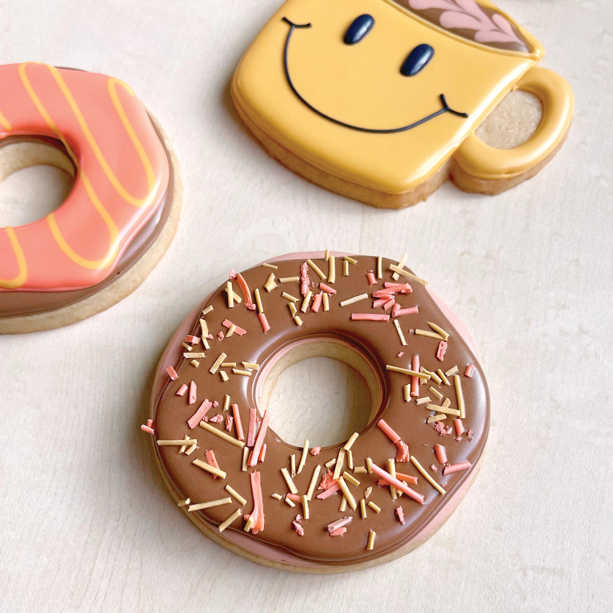 cookies decorated as donuts and coffee