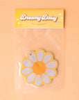 A yellow, white and orange daisy shaped air freshener.