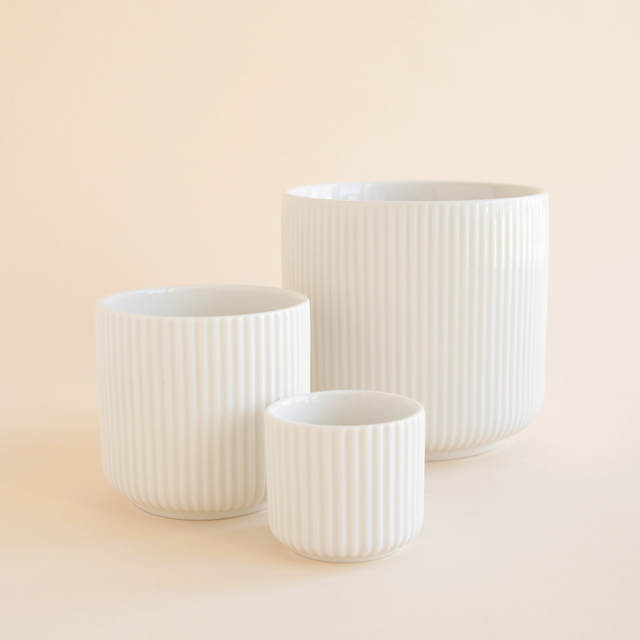 small white plastic plant pots Lucy Planter