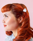 A mini white ghost shaped hair clip.