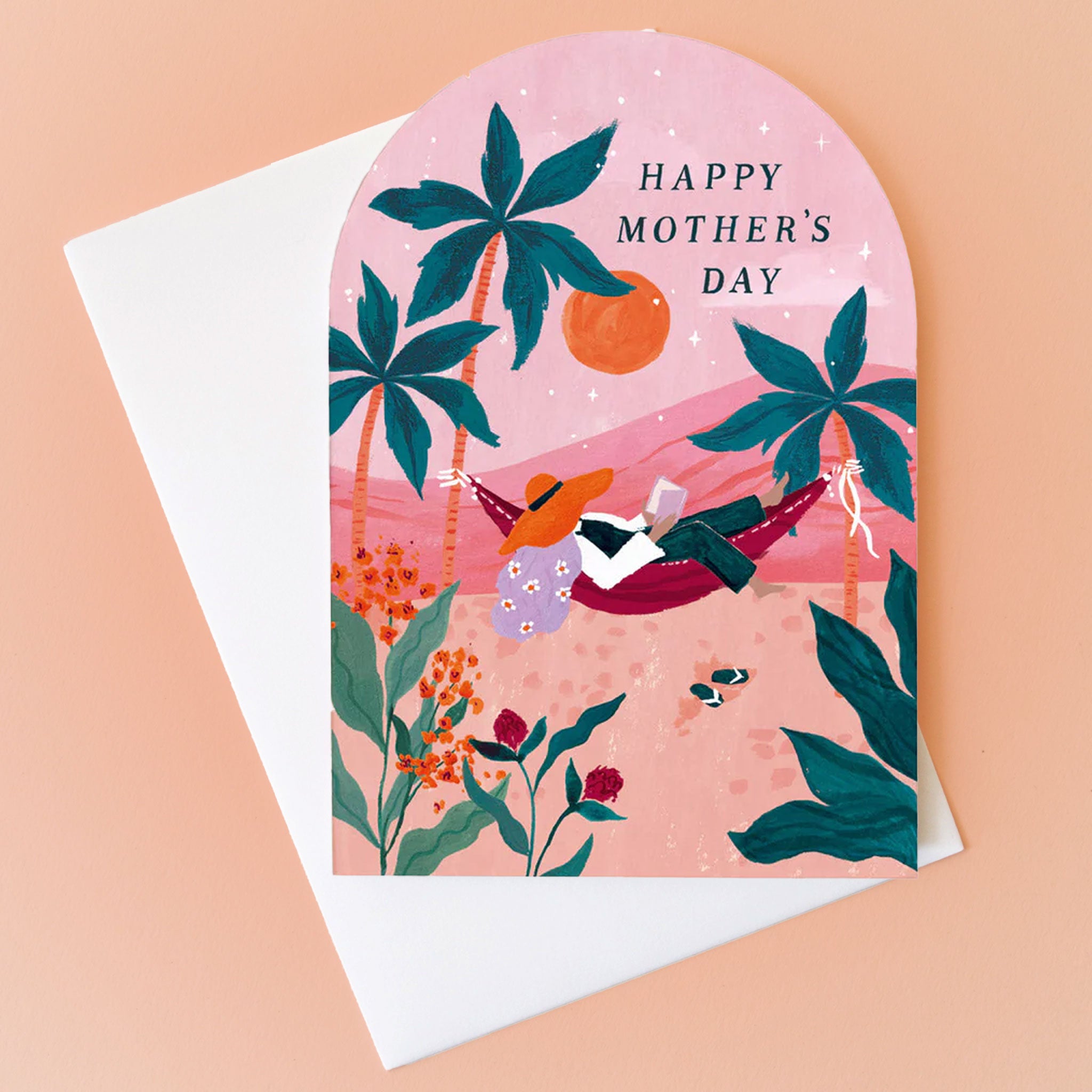 On a peachy background is an arched card with a palm tree illustration and text that reads, "Happy Mother's Day". 