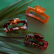 A trio of hair clips in different animal print patterns.