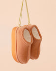 A tan pair of UGG inspired slipper shaped ornament.