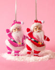 Two Santa shaped ornaments with a loop for hanging. Each ornament sold separately.