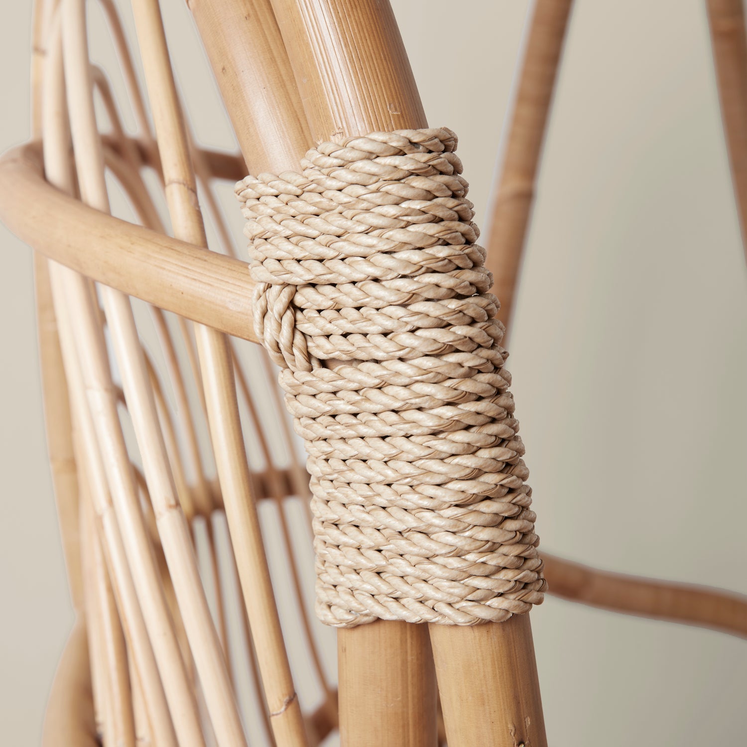A close up of the rope detailing on the hanging rattan chair. 