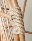 A close up of the rope detailing on the hanging rattan chair.