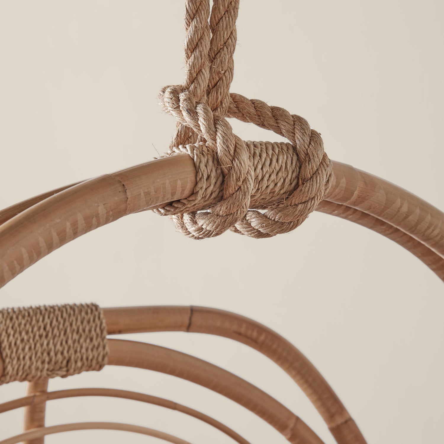 A close up of the rope detailing on the hanging rattan chair.