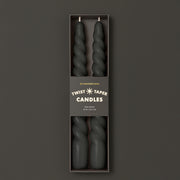 A pair of twisted black taper candles.