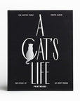 A black photo album book cover with white text that reads, 'A Cat's Life'.