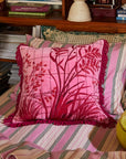 A hot pink floral pillow cushion.
