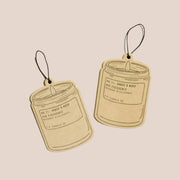 A set of two air fresheners in the shape of a candle.