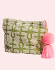 A green and ivory terry cloth pouch with a pink tassel.