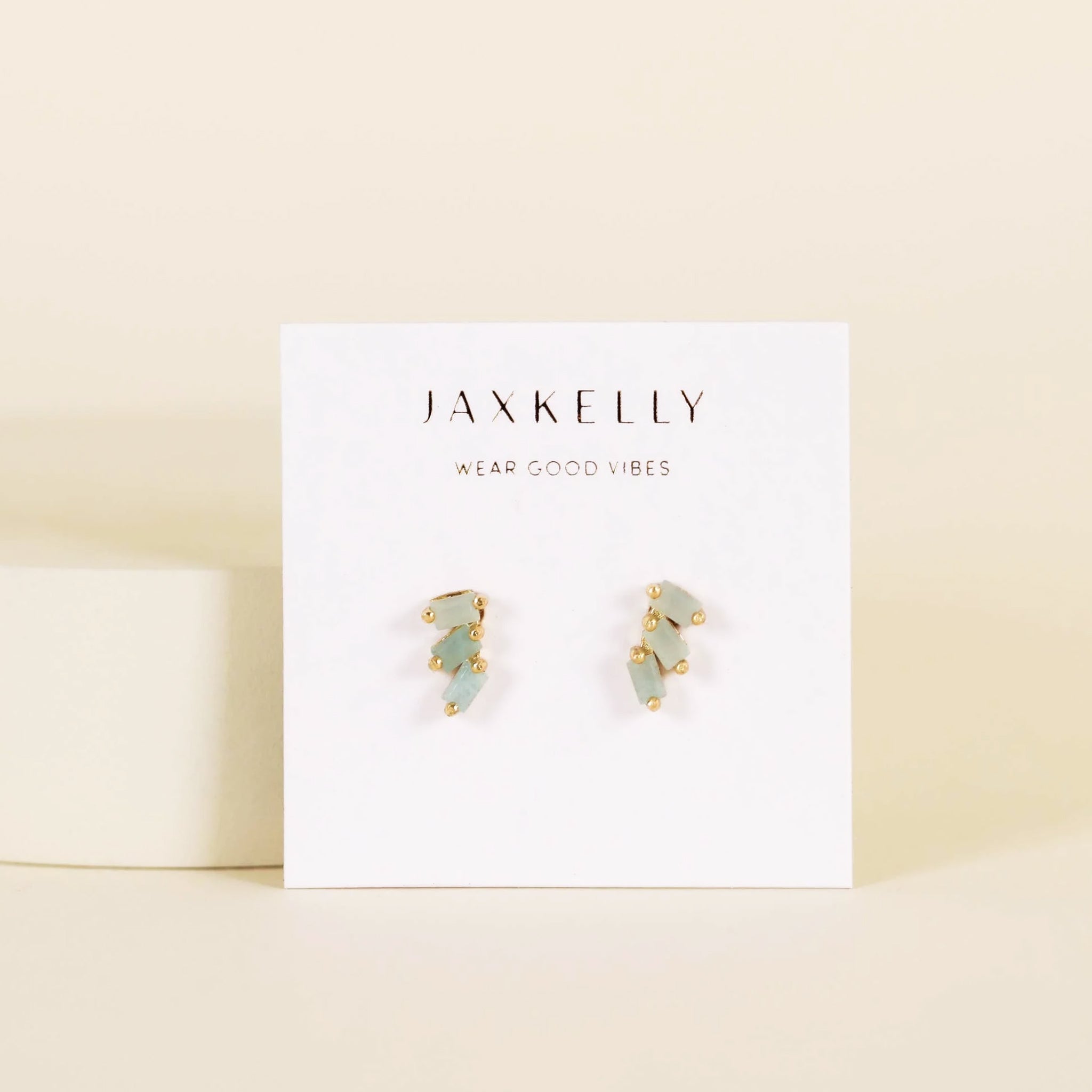 A pair of stud earrings with three amazonite stones stacked on one another. 
