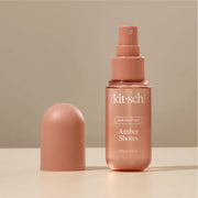 A bottle of amber scented hair perfume that reads, 'kit-sch hair perfume amber shores'.