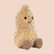 A neutral peanut shaped stuffed animal.