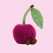 A dark pink cherry shaped stuffed toy.