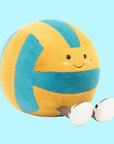 A blue and yellow stuffed toy in the shape of a volleyball with adorable legs, feet and a smiling face.