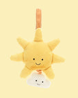 On a yellow background is a yellow sun and cloud shaped stuffed toy with a retractable pull and velcro loop for hanging.