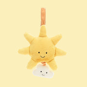 On a yellow background is a yellow sun and cloud shaped stuffed toy with a retractable pull and velcro loop for hanging.