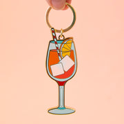 An aperol spritz shaped keychain.
