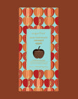 An apple graphic packaged caramel apple flavored chocolate bar with text that reads, 'sugarfina Milk Chocolate caramel apple'.