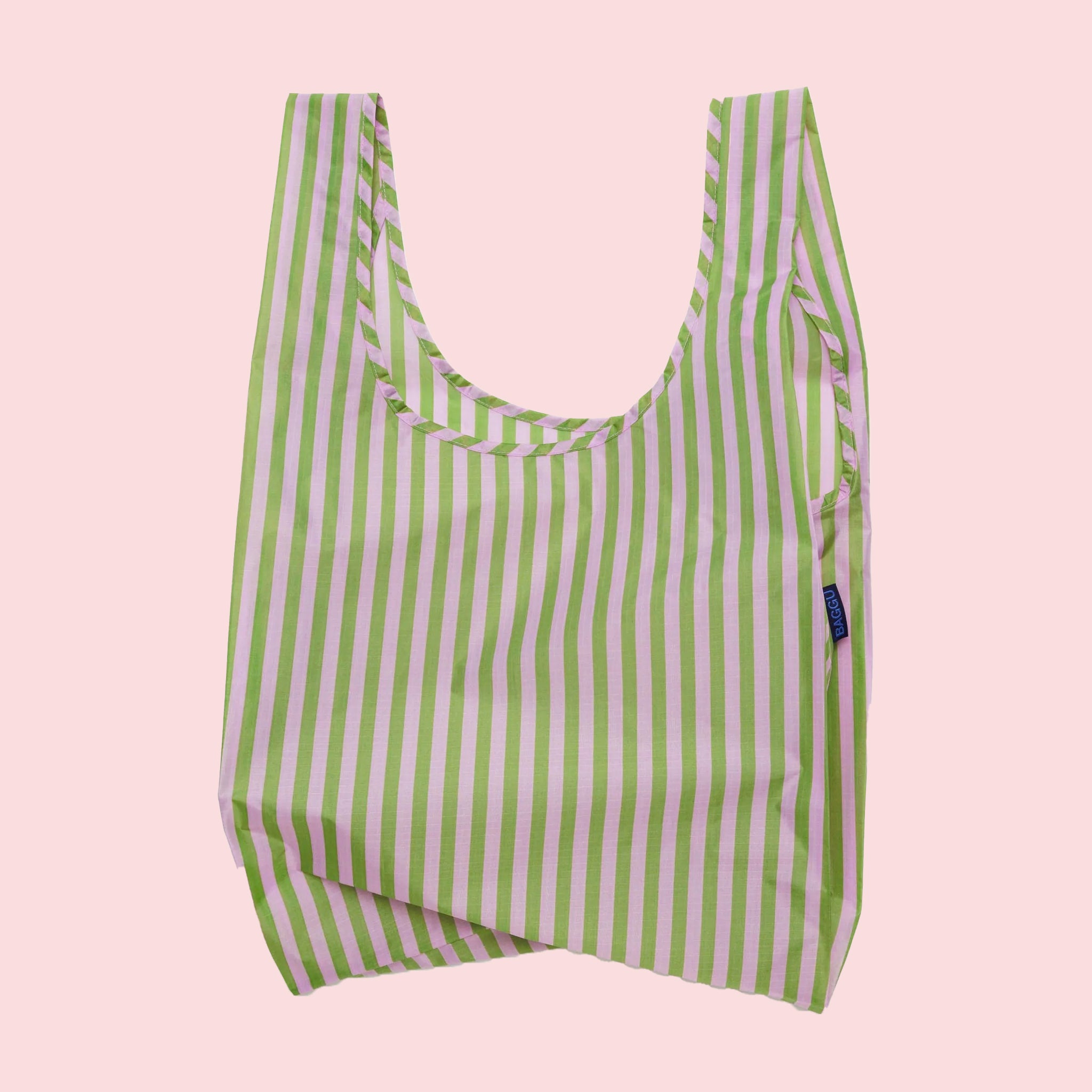 A light pink and green striped nylon reusable tote bag. 