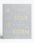 A light greyish blue photo album cover with text that reads, 'A Star Is Born'.