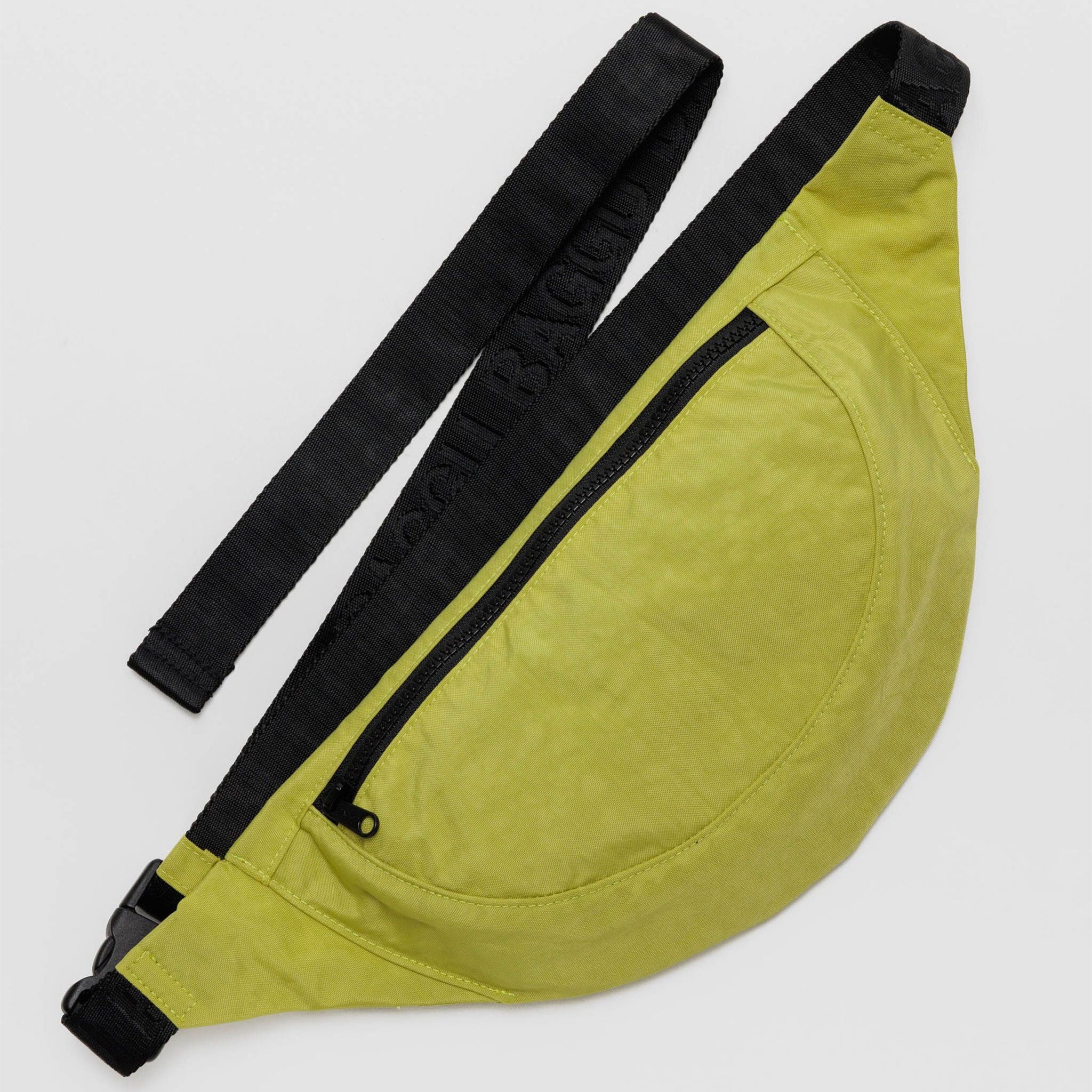 A crescent shaped fanny pack in lime green color with black strap.