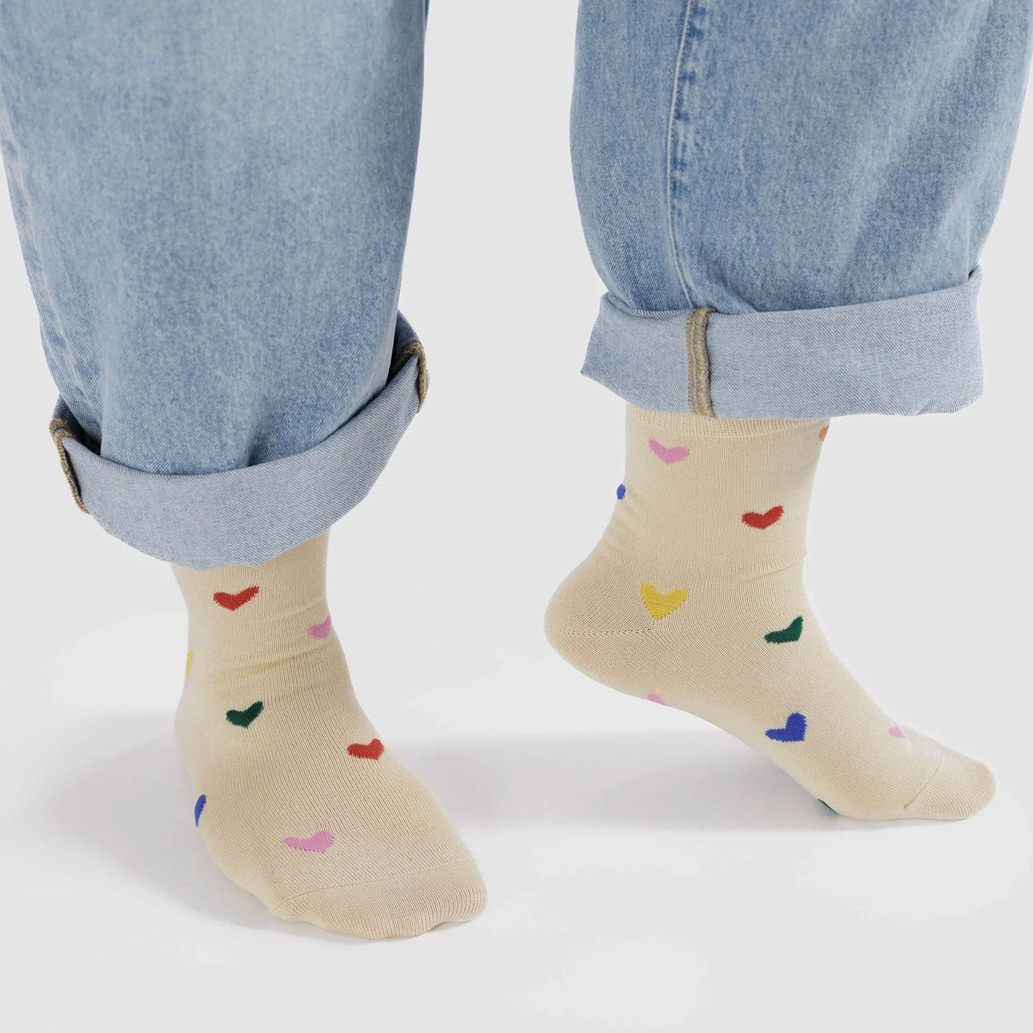 neutral socks witch small colorful hearts