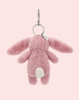 A pink bunny shaped bag charm with silver hanging loop details.