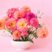 A rounded low pedestal bow in a vintage ivory shade. Plantings are just used for staging purposes and are sold separately.